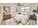 Well lit bedroom featuring a ceiling fan, hardwood floors, and neutral décor at 5703 Andrea Dr, Holiday, FL 34690