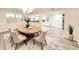 Dining room with an oval table, seating for six, and an open view into the kitchen at 5703 Andrea Dr, Holiday, FL 34690