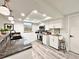 Contemporary kitchen with a dark countertop, stainless steel appliances, and modern pendant lighting at 5703 Andrea Dr, Holiday, FL 34690