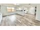 Spacious open-concept living area featuring bar seating and an open view into the updated kitchen at 5703 Andrea Dr, Holiday, FL 34690