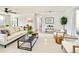 Bright, airy living room with light wood floors and stylish furniture, perfect for relaxation at 5703 Andrea Dr, Holiday, FL 34690