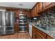 Kitchen with stainless steel appliances, including a refrigerator, oven, and microwave at 6028 Central Ave, New Port Richey, FL 34653