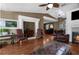 Cozy living room with hardwood floors, fireplace, and a relaxing atmosphere at 6028 Central Ave, New Port Richey, FL 34653