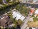 Aerial view of a home with lush landscaping and a private pool, nestled in a waterfront community at 6726 Udell Ln, Hudson, FL 34667