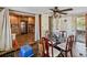 Dining area with wooden table and chairs adjacent to the kitchen at 6726 Udell Ln, Hudson, FL 34667