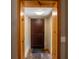 Warm wooden front door with rustic trim and hardwood floors, ready for your personal touch at 6726 Udell Ln, Hudson, FL 34667