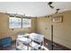 A room with a window, track lighting and unfinished walls at 6726 Udell Ln, Hudson, FL 34667