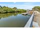 Picturesque waterfront view with a private dock, ideal for boating and enjoying serene water activities at 6726 Udell Ln, Hudson, FL 34667