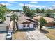 Aerial view of a single-Gathering home featuring a long driveway and mature landscaping at 6915 N Hubert Ave, Tampa, FL 33614