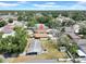 Aerial view of home with mature trees and neighborhood setting at 6915 N Hubert Ave, Tampa, FL 33614