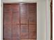 Full view of a closet with dark wooden shutter doors at 6915 N Hubert Ave, Tampa, FL 33614