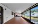 Long screened porch with brick floor at 6915 N Hubert Ave, Tampa, FL 33614