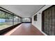 Screened in patio with tile floor and large windows at 6915 N Hubert Ave, Tampa, FL 33614