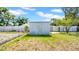 Metal storage shed in the backyard with fence at 6915 N Hubert Ave, Tampa, FL 33614