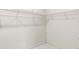 Spacious walk-in closet featuring wire shelving and tile floors at 6915 N Hubert Ave, Tampa, FL 33614