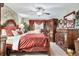 Bedroom with decorative bedding, ceiling fan, and dresser with mirror at 803 Woodcarver Ln, Brandon, FL 33510