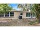 View of the home's backyard and screened in patio at 810 W River Dr, Temple Terrace, FL 33617