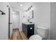 Bright bathroom featuring modern vanity with sink and updated fixtures and toilet at 810 W River Dr, Temple Terrace, FL 33617