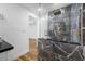 Elegant bathroom showcasing a glass shower with marble tile and a sleek vanity with gold fixtures at 810 W River Dr, Temple Terrace, FL 33617