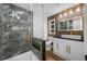 Modern bathroom with sleek glass shower, marble tile, and stylish vanity with a vessel sink at 810 W River Dr, Temple Terrace, FL 33617