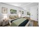 Bright bedroom with stylish decor, wood floors, white walls, and natural light at 810 W River Dr, Temple Terrace, FL 33617