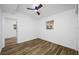 Bedroom with wood floors, a ceiling fan, and a window at 810 W River Dr, Temple Terrace, FL 33617