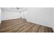 Spacious bedroom featuring wood-look flooring, ceiling fan, ensuite bathroom and multiple closets at 810 W River Dr, Temple Terrace, FL 33617