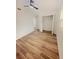 Bedroom featuring ceiling fan, closet, and wood floors at 810 W River Dr, Temple Terrace, FL 33617