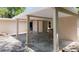 Covered carport featuring stone accent wall detail, with access to home at 810 W River Dr, Temple Terrace, FL 33617