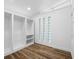 Walk-in closet with built-in shelving and natural light at 810 W River Dr, Temple Terrace, FL 33617