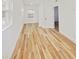 Hallway featuring wood flooring and natural light at 810 W River Dr, Temple Terrace, FL 33617