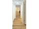 Hallway featuring wood flooring and overhead lighting at 810 W River Dr, Temple Terrace, FL 33617
