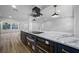 Open kitchen with large island, custom cabinetry, and stainless steel appliances at 810 W River Dr, Temple Terrace, FL 33617