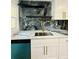 Gourmet kitchen featuring marble countertops, stainless steel sink, and modern appliances at 810 W River Dr, Temple Terrace, FL 33617