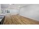 Spacious living room with wood-look floors, recessed lighting, and an open layout to the kitchen at 810 W River Dr, Temple Terrace, FL 33617