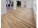 Open concept living room featuring updated wood floors at 810 W River Dr, Temple Terrace, FL 33617