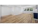 Open living room showcasing wood flooring, natural light, and seamless flow at 810 W River Dr, Temple Terrace, FL 33617