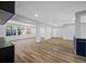 Bright and airy living room features wood-look flooring, recessed lighting, and an open floor plan at 810 W River Dr, Temple Terrace, FL 33617