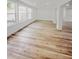 Bright living room with wood floors and large windows at 810 W River Dr, Temple Terrace, FL 33617