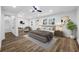 Spacious main bedroom with hardwood floors, ample natural light, and a comfortable seating area at 810 W River Dr, Temple Terrace, FL 33617