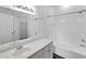 Bathroom featuring a vanity with countertop space and a shower-tub combination at 9602 Lake Chase Island Way # 9602, Tampa, FL 33626