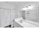 Bright bathroom featuring a spacious vanity, large mirror, and updated lighting fixtures at 9602 Lake Chase Island Way # 9602, Tampa, FL 33626