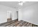 Bright bedroom with an en-suite bathroom and wood style flooring at 9602 Lake Chase Island Way # 9602, Tampa, FL 33626