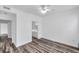 The bedroom has a ceiling fan, wood-look floors, and an ensuite bathroom for maximum comfort at 9602 Lake Chase Island Way # 9602, Tampa, FL 33626
