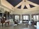 Elegant clubhouse featuring a piano and comfortable seating areas, ideal for gatherings at 9602 Lake Chase Island Way # 9602, Tampa, FL 33626