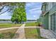 Picturesque view of home next to a tranquil lake, showcasing a harmonious blend of nature and residential living at 9602 Lake Chase Island Way # 9602, Tampa, FL 33626