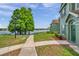Townhouse with lush green lawn and scenic lake view at 9602 Lake Chase Island Way # 9602, Tampa, FL 33626