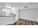 Open-concept living area connected to the kitchen with breakfast bar and modern lighting at 9602 Lake Chase Island Way # 9602, Tampa, FL 33626