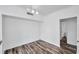 Bright living room with modern lighting, wood-look floors, and an open feel at 9602 Lake Chase Island Way # 9602, Tampa, FL 33626