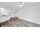 Bright living room with modern wood floors and breakfast bar at 9602 Lake Chase Island Way # 9602, Tampa, FL 33626